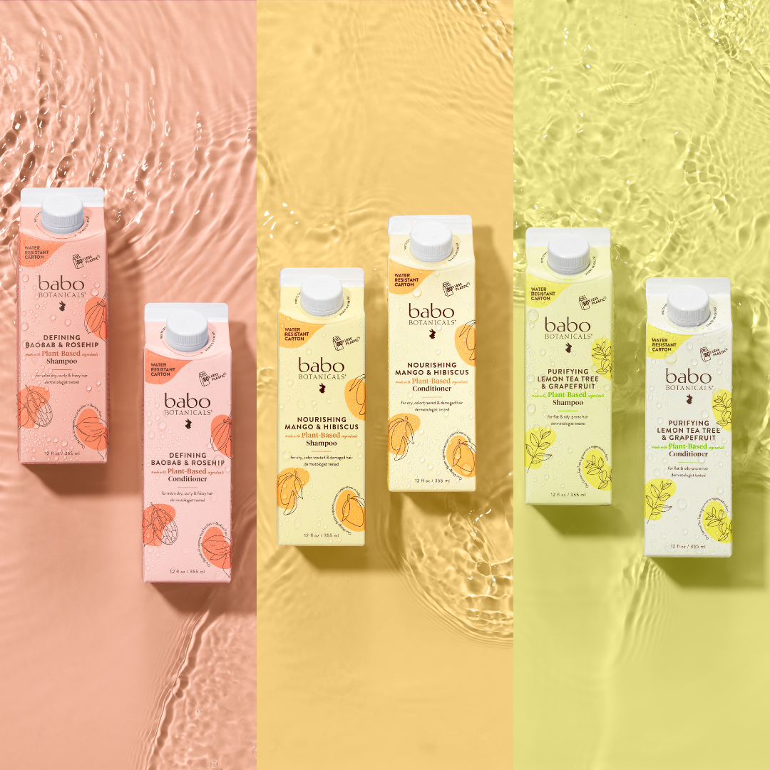 Babo Botanicals plant-based shampoo and conditioner in eco-friendly packaging, featuring Defining Baobab & Rosehip, Nourishing Mango & Hibiscus, and Purifying Lemon Tea Tree & Grapefruit varieties against peach, yellow, and green backgrounds with water ripple effect